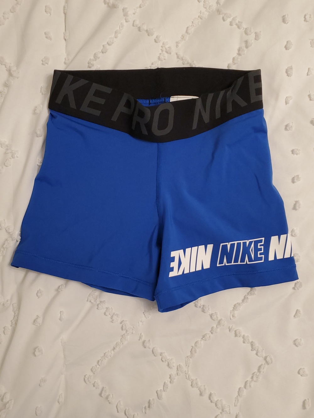 Nike Blue Compression Shorts with Black Waistband and White Logo